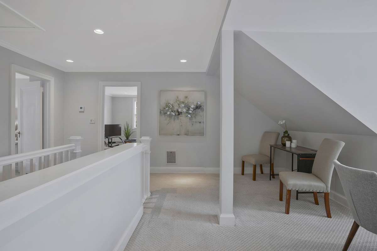 Another view of the second-level landing with plenty of space for a desk or lounge area.
