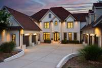 You will think you have arrived at a luxury resort when you see this incomparable home in prestigious Governors Club.