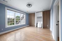 One of three upstairs bedrooms.  This one has a hidden desk/make up table in the wall.  The other doors are also hidden and one goes to the closet and one to the immense attic.