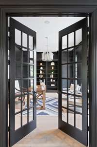 Just off the front foyer is a cozy office/library in a striking hue.