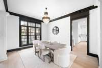 Large windows flank the lovely dining room