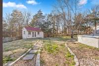 Shed provides great storage, Tree line for privacy and view.