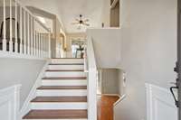 entryway with split stairs to each level