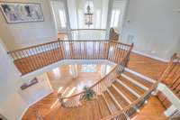 Spiral staircase with large landing and open feeling guides you to the second story