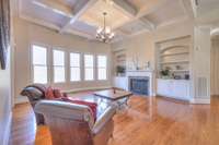 Artistic ceilings and custom built-ins add such character to this living room