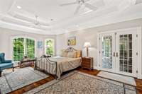 The cherry flooring extends throughout the entire main level of the home. The bedroom has its own private doorway to the upper deck.