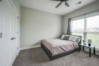 First floor secondary bedroom with close access to downstairs full bathroom with like new carpet and natural light.
