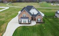 Expansive property backing up to serene farmland for privacy and picturesque views.