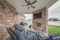 Spacious covered patio, perfect for relaxing while enjoying the private backyard.