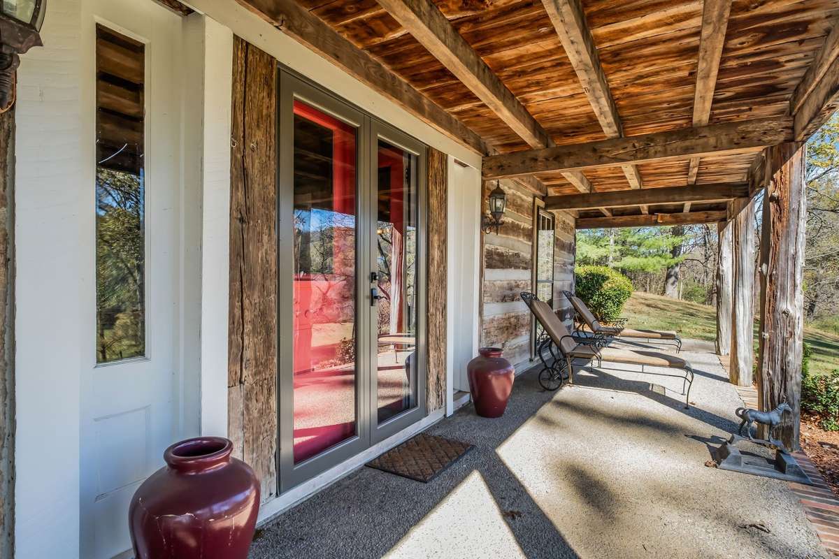 Two doors make the front entryway. When the weather is right, leave them open and set a table on the porch for a perfect meal outside.