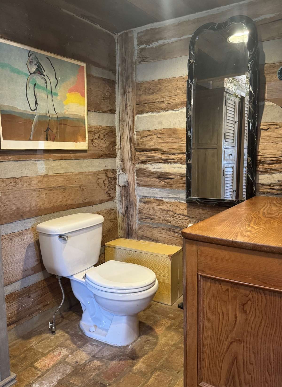 Seperate toilet area in primary bathroom.