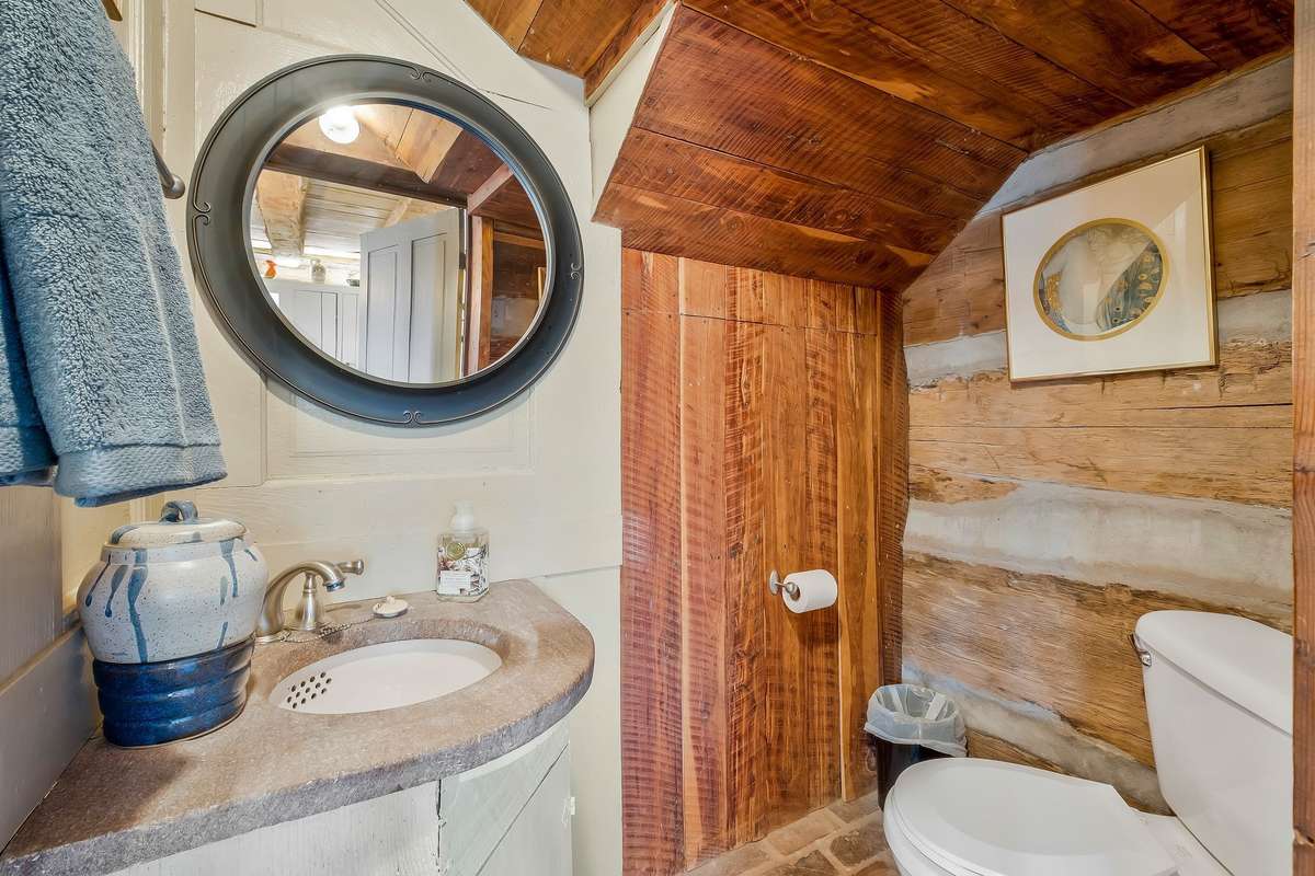 A half bath is located under the stairwell.