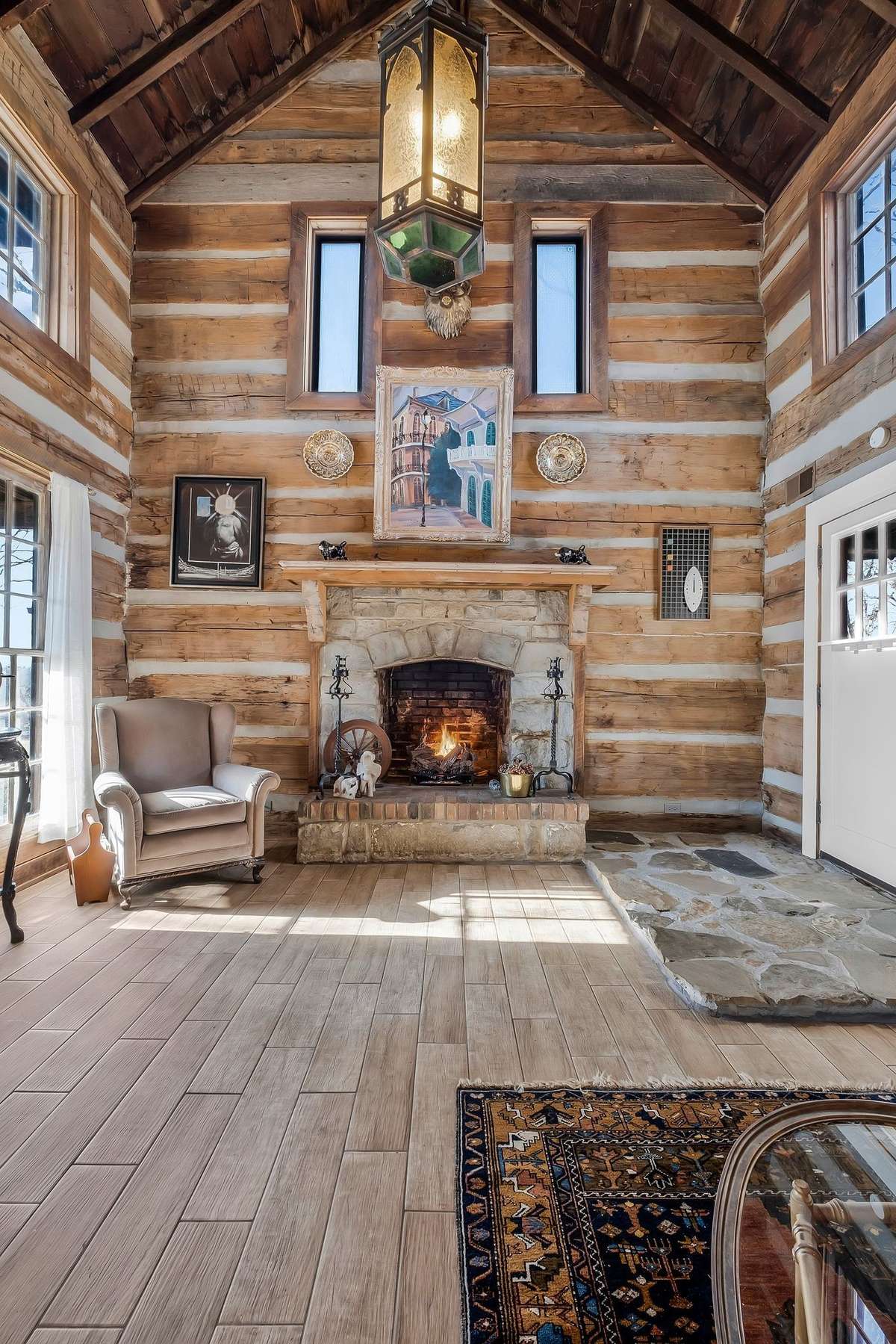 There is a two-story ceiling in the living room, which makes for a dramatic setting.