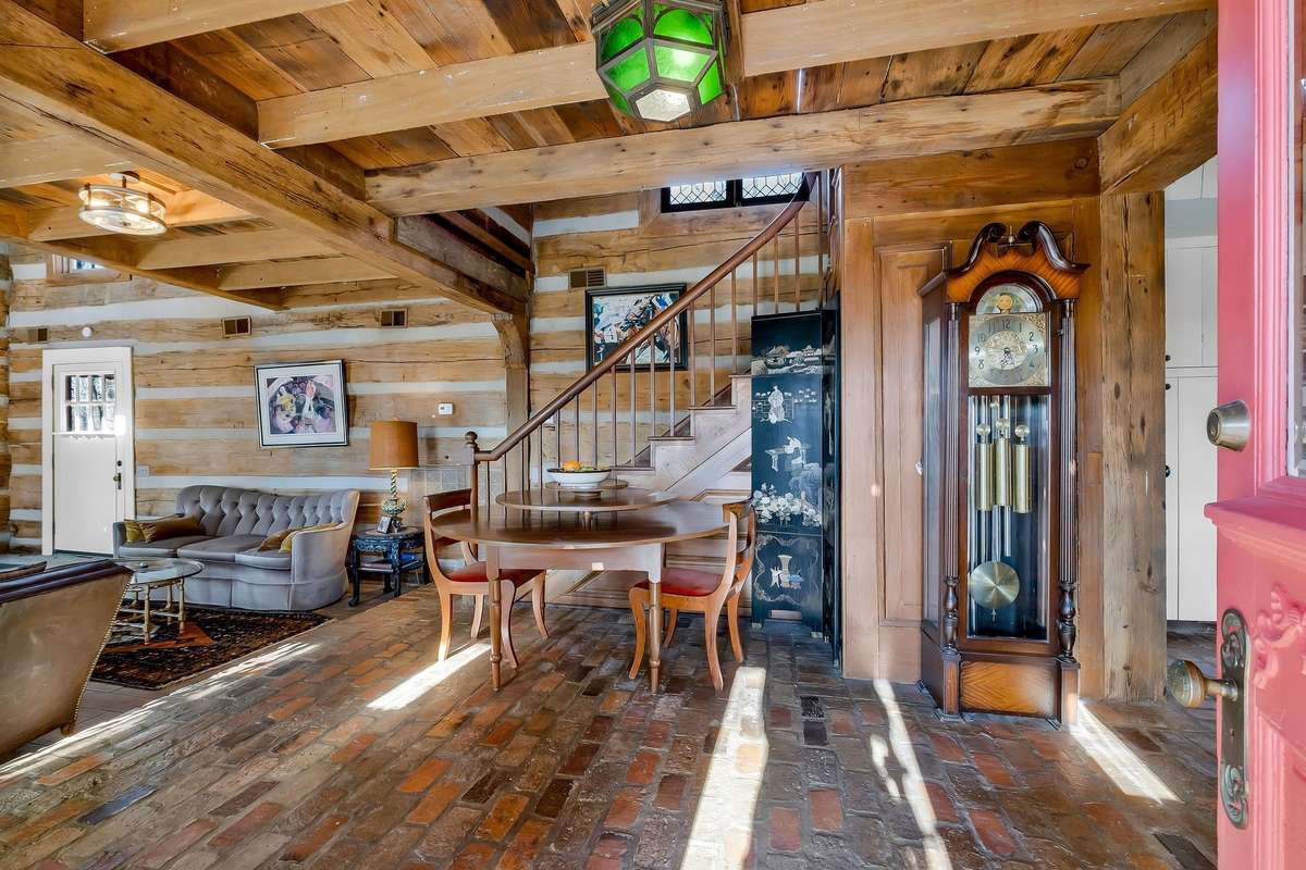As you enter through the double doors, you'll find reclaimed brick floors that are only the beginning of many uniques features.