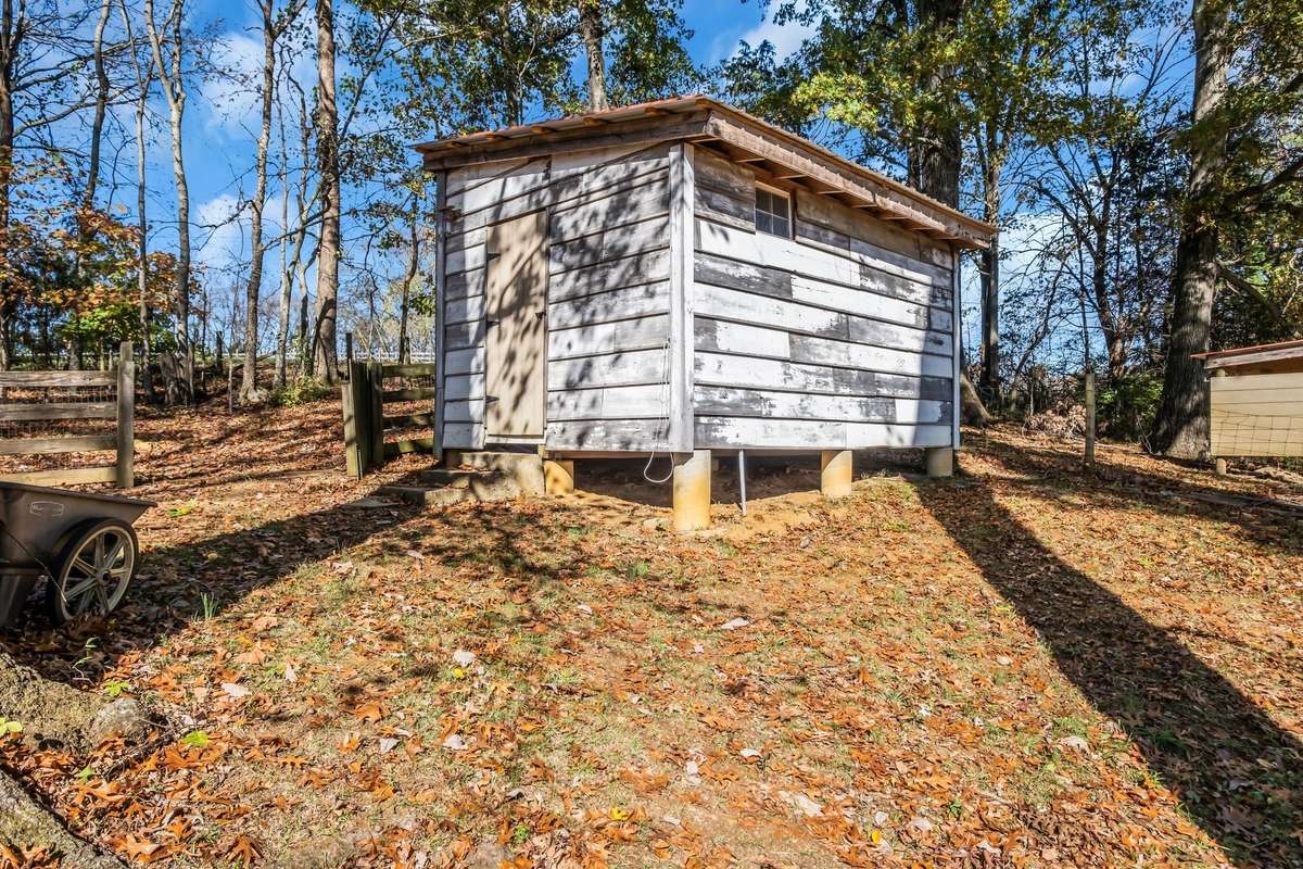 A storage shed is located behind the house. The owner has run electricity to it for convenience.