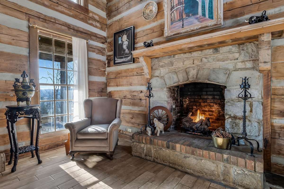 Braxto Dixon was known as a master stone mason. The two fireplaces in the home show that. While constructed as a wood burning fireplace, the current owner has added a set of gas logs for convenience.