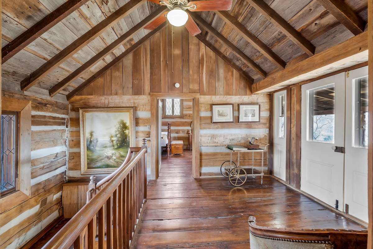 The sitting area at the top of the stairs would make a great reading nook. The doors lead to the second level full porch.