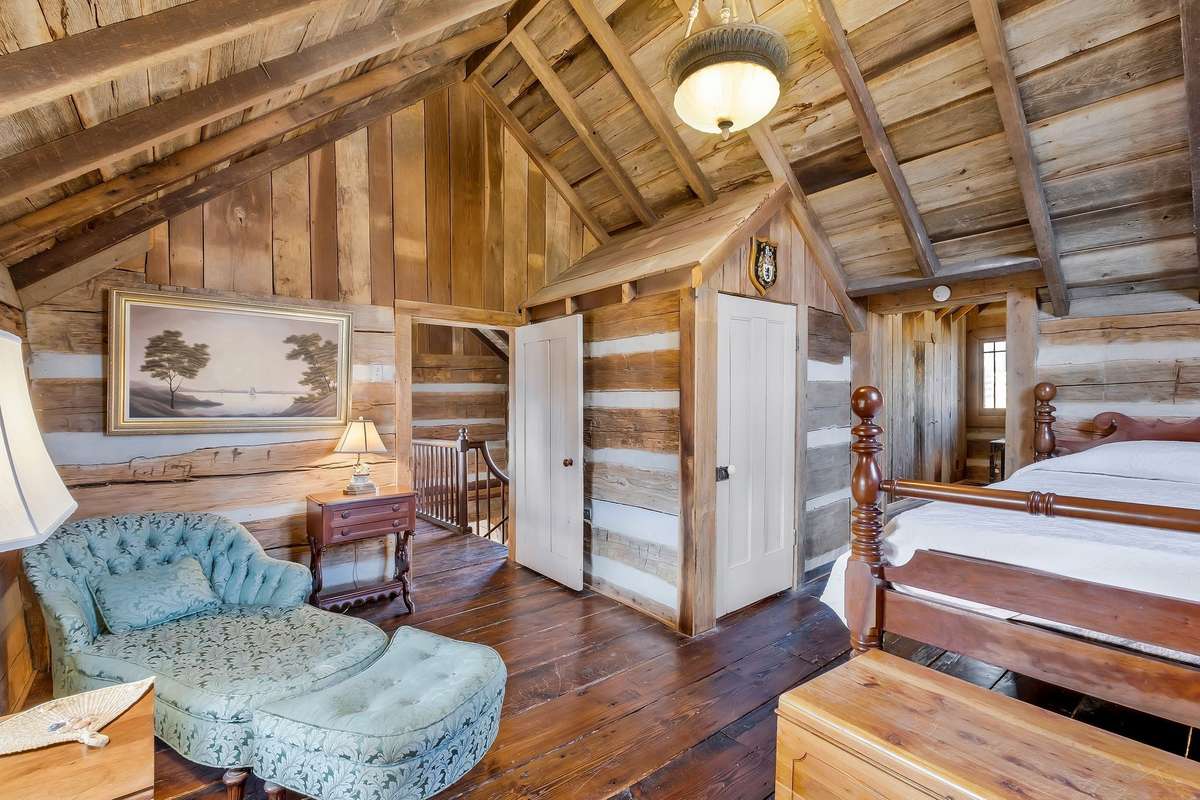 The doorway in the center is the entry door. A full bath is located in this room.