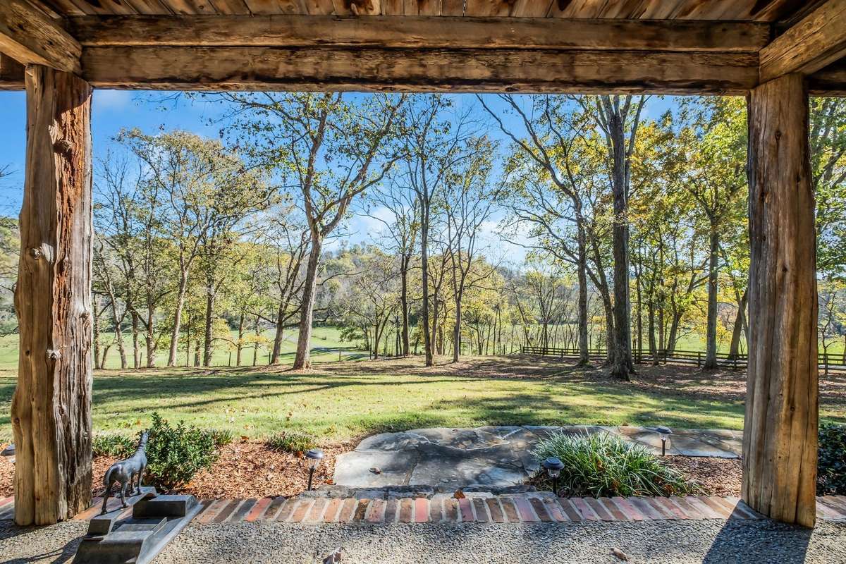 Take in the view from the full-length front porch before you go inside.