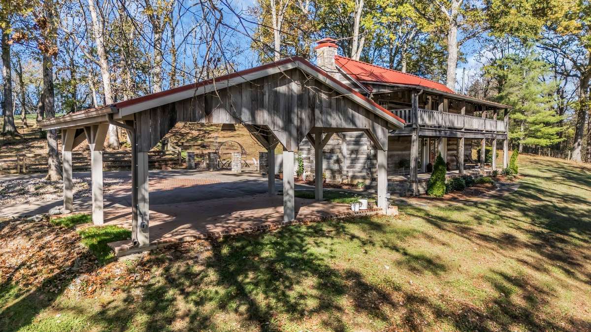 There is parking around the circular driveway that would permit you to use the carport as a pavilion if you needed to entertain outside during inclement weather. And you'd have a beautiful view of the front pasture.