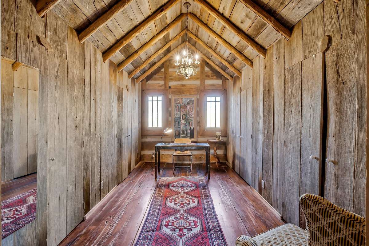 The third bedroom is entered from the second bedroom. It is currently configured as an office. Extra closets line both walls in the eaves.