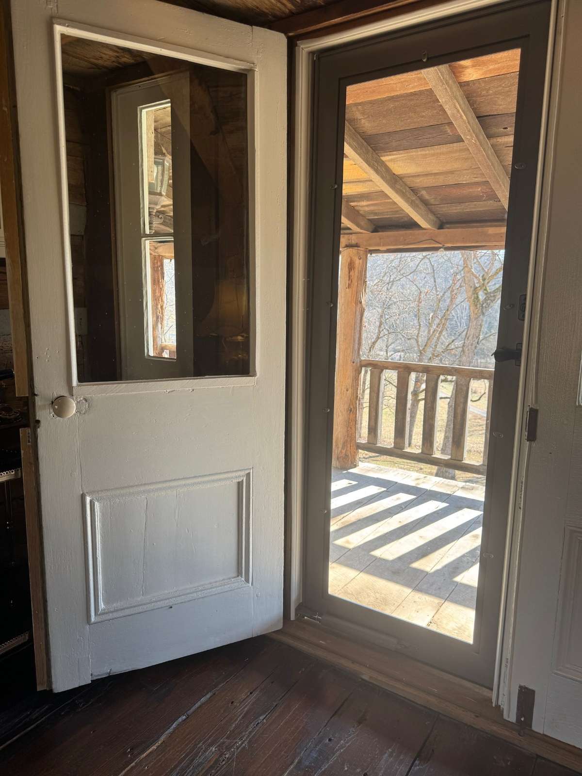 Detail of door leading to upper exterior balcony.