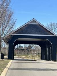 Who wouldn't love driving through a covered bridge on the way to their new home at 8809 Drosera Circle?