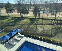 One of several ponds is in the short distance on the Greg Norman-designed golf course.