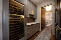 Wine cooler and walk through the butler's pantry.