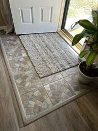 Custom tile work as you enter the home from the front door!!