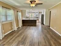 The view as you enter from the front door.  Open floorplan with living room & kitchen!!