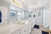 Beautiful primary bathroom with spilt double vanities and tile flooring. 2326 Amber Glen Dr.  Murfreesboro, TN 37128