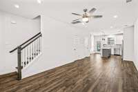 Beautiful wood floors in the open floor plan living room/kitchen