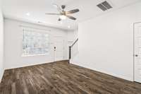 Beautiful wood floors in the open floor plan living room/kitchen