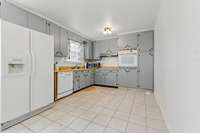 The kitchen has tons of space and storage, and...