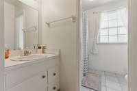 On the 3rd level is the full bathroom. It's a Jack and Jill bathroom, with and entrance from the hallway and the primary bedroom.