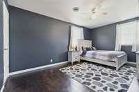 Have lots or bedroom furniture? The primary bedroom, has the room for it!  Got to love the floor and the 2 windows.