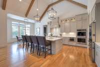Open kitchen with lofted ceilings