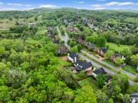 Located in the desirable Wynbrooke neighborhood and zoned for Station Camp schools! Enjoy these stunning drone views showcasing the home, peaceful community, and convenient proximity to the lake, shopping, dining, and more.