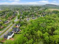 Located in the desirable Wynbrooke neighborhood and zoned for Station Camp schools! Enjoy these stunning drone views showcasing the home, peaceful community, and convenient proximity to the lake, shopping, dining, and more.
