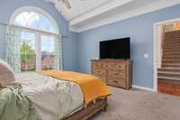 Spacious main-floor primary bedroom with a professionally updated, spa-like bathroom featuring a soaking tub, walk-in shower, double vanities, and large walk-in closets—your personal retreat awaits!