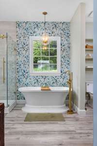 Unwind in the spa-like soaking tub—perfect for relaxing after a long day in your beautifully updated main-floor retreat.