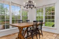 Enjoy views of the backyard oasis from this spacious kitchen, complete with a granite island, an abundance of cabinetry, upgraded backsplash, and a cozy eat-in breakfast area. Just steps away from the outdoors—perfect for everyday living!