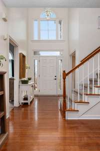 Step inside to see this amazing home! Hardwood floors, soaring ceilings, Primary Bed/Bath on Main Floor and views of the backyard oasis!