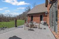 Spacious back patio overlooks rolling views of Williamson County.