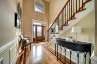 Two story entry foyer, mahogany front door