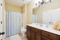 A second full bathroom upstairs. Can be accessed by hallway or adjoining bedroom