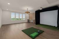Family Room upstairs complete with a wet bar and golf simulator.