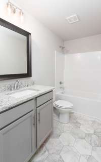 Bathroom #2 Upstairs with Granite Countertops and a Tub/Shower Combo
