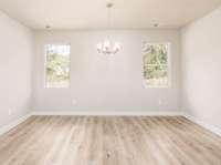 Fantastic Space in this Formal Dining Room with a great view of the Tree-Lined Back-Yard